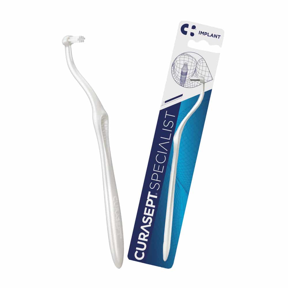 toothbrush and Curasept Specialist implant pack
