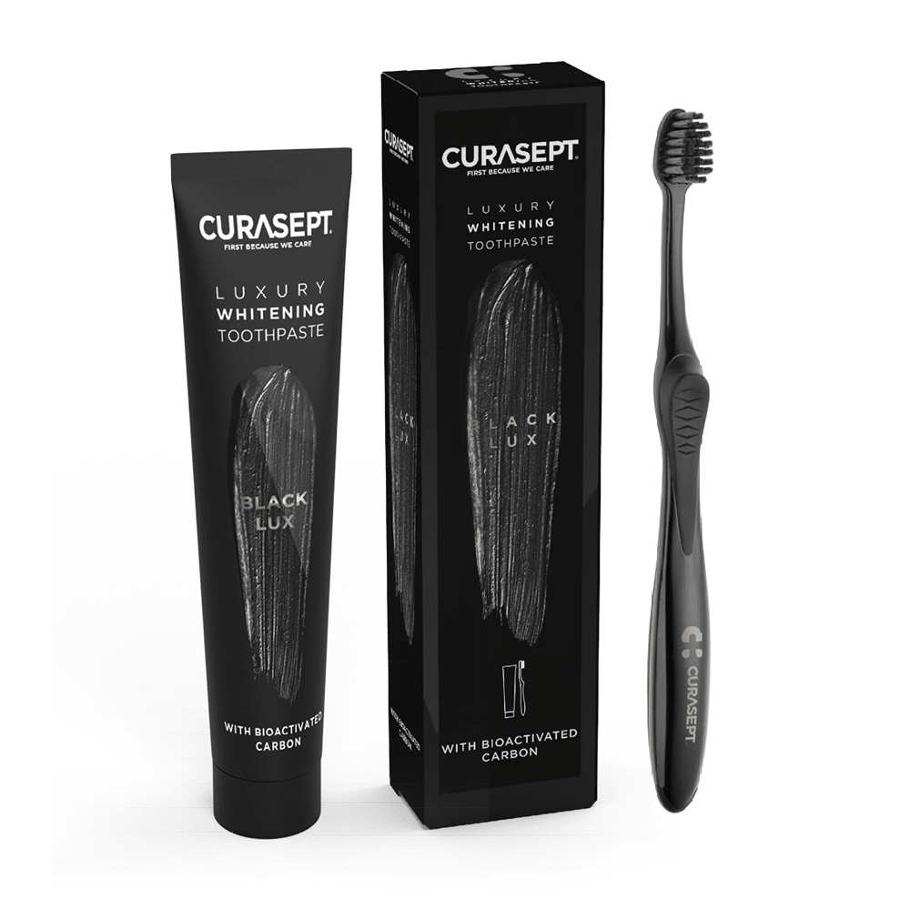 toothbrush, toothpaste and pack Curasept Whitening Luxury black