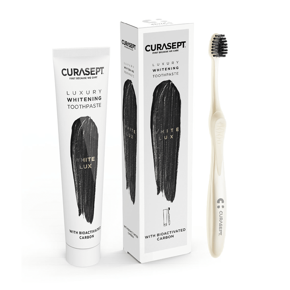 toothbrush, toothpaste and its packaging Curasept Luxury white